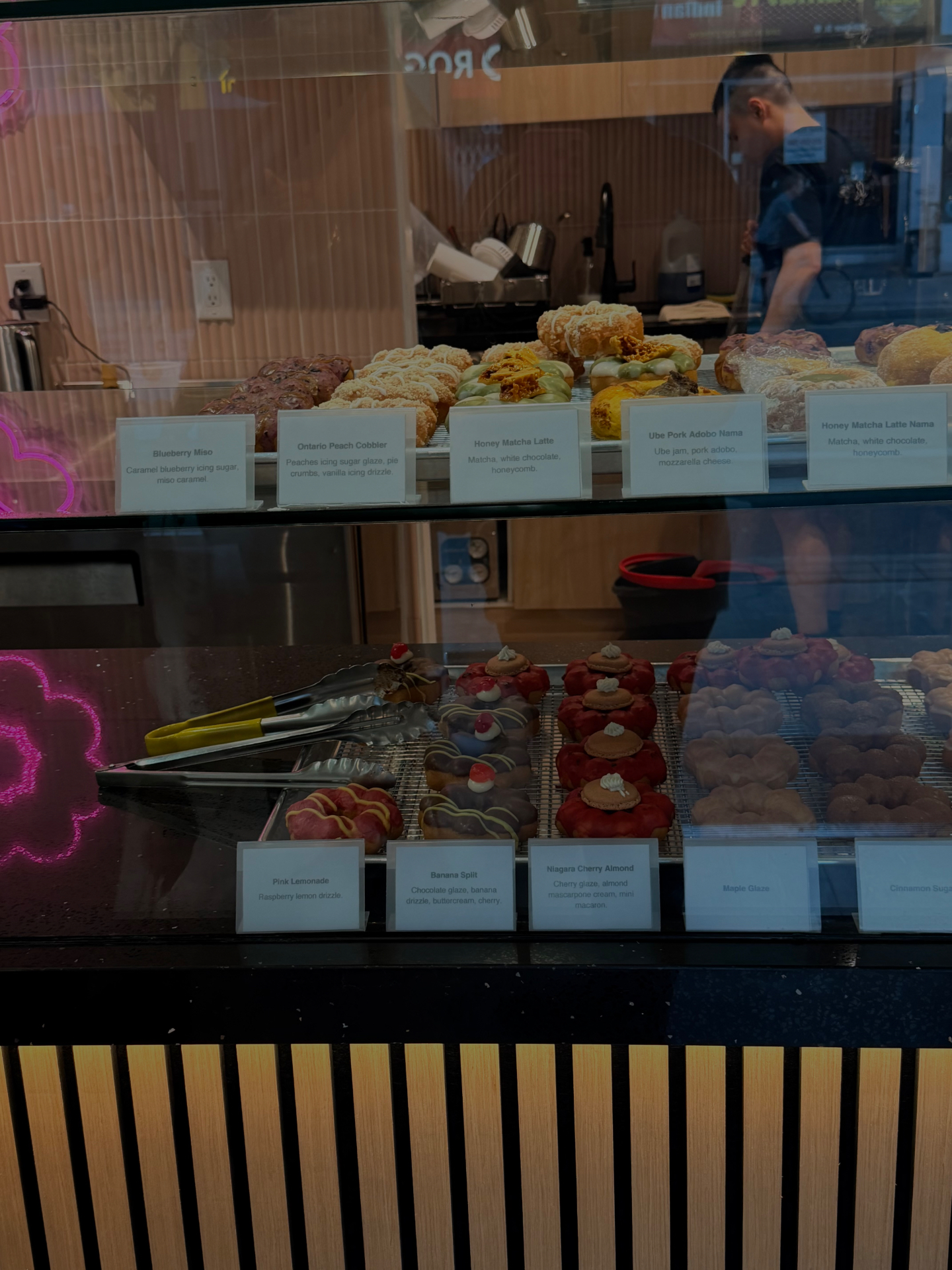 A display case of colourful donuts